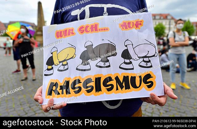 12 June 2021, Thuringia, Erfurt: A demonstrator holds a poster with the inscription ""Wir sch... on racism"" at a demonstration of the group ""Grannies against...