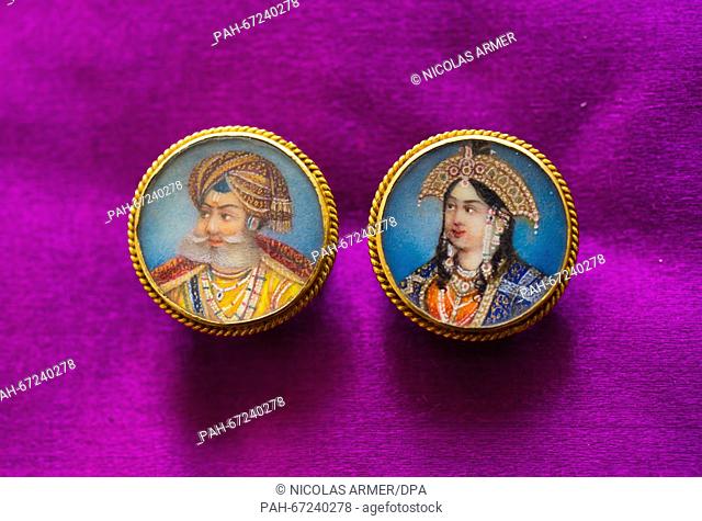 Two buttons made from 24-carat gold featuring delicate miniature painting from around 1900 show the portraits of a maharaja and his maharani, in Kulmbach