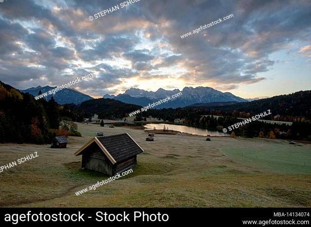 sunrise at geroldsee in autumn, heustadel, karwendel mountains, klais, werdenfelser land, bavaria, germany
