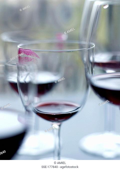 Glasses of red wine with marks of lipstick