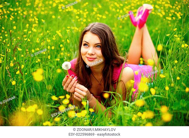 summer woman blow on dandelion
