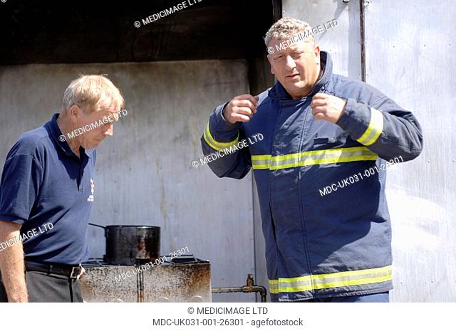 Two off-duty firefighters from the Hertfordshire Fire & Rescue Service, UK. In December 2005, HFRS dealt with what is thought to Britainâ€™s largest fire since...