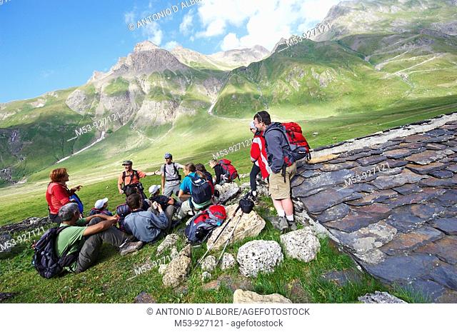 group of hikers at bettelmapp alpine pasture  lepontine alps  Verbano Cusio Ossola province  piemonte  italy  europe