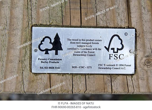 'Forest Stewardship Council' label on wooden table, product comes from well managed forests, Dorset, England