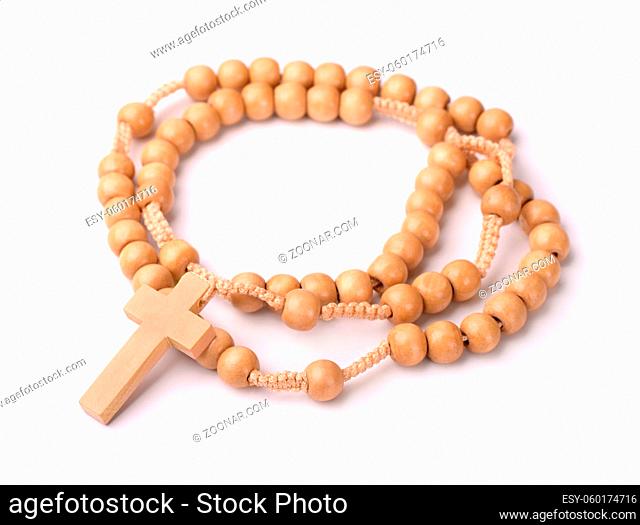 Wooden rosary beads and cross isolated on white