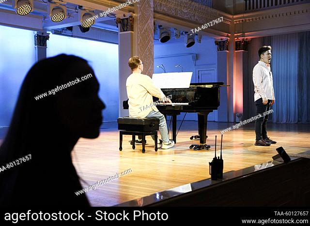 RUSSIA, NOVOSIBIRSK - JUNE 28, 2023: Concertmaster Andrzej Dikovic (L) and student Altankhuyag Otgonbold perform during a rehearsal for the Novosibirsk State...