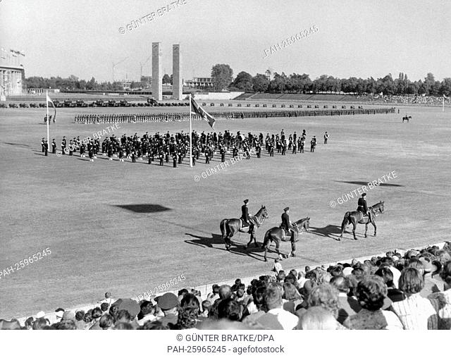 A parade of the British garrison in honour of Queen Elizabeth II.'s birthday takes place on the 13th of June in 1957 on Maifeld in front of the Olympia Stadium...