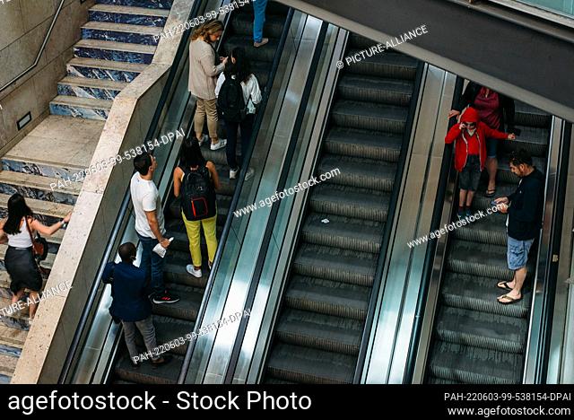 03 June 2022, Portugal, Lissabon: Travelers use the escalators at Rossio station in Lisbon. In the popular vacation destination of Portugal
