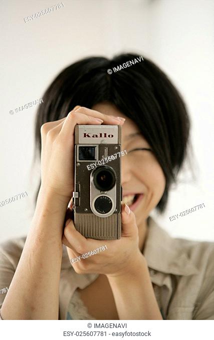 Young woman taking a video