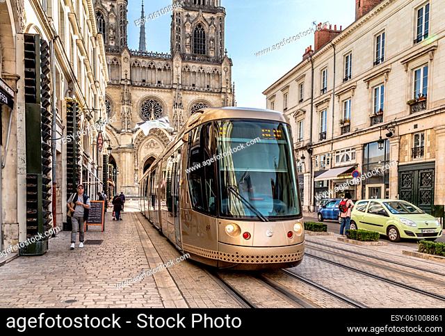 Orleans, France, October 11, 2019: TramiOrleans center with Royal cathedral of the Holy Cross in the background