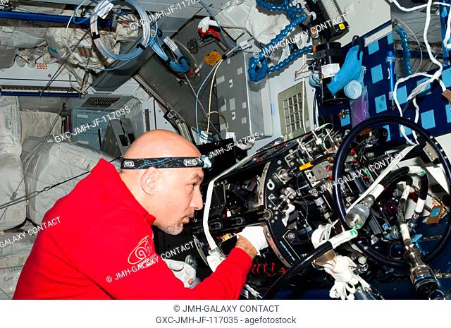 European Space Agency astronaut Luca Parmitano, Expedition 36 flight engineer, works on the Multi-User Droplet Combustion Apparatus (MDCA) Chamber Insert...