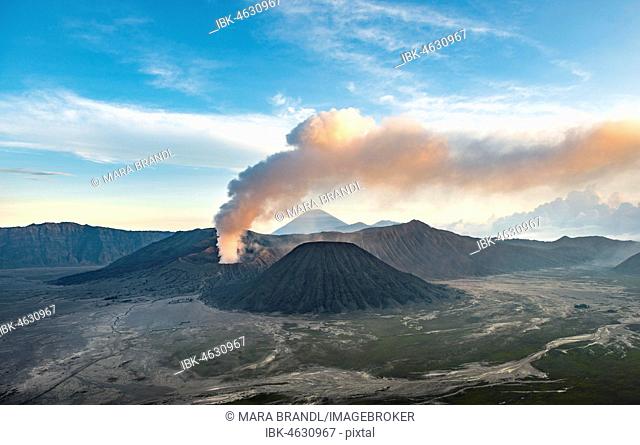 View of volcanoes at sunset, smoking volcano Gunung Bromo, Batok, Mt. Kursi, Gunung Semeru, National Park Bromo-Tengger-Semeru, Java, Indonesia