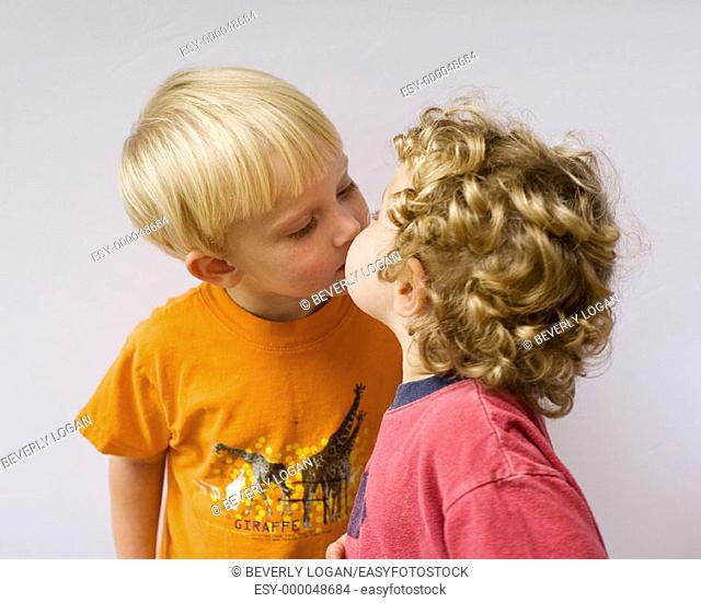Cousins kissing; two boys age 3 and 2