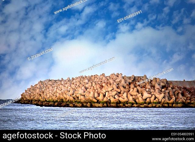 The seawall around the sea port facilities is made of concrete tetrapods (traveling-wave protection), rubble-mound breakwater