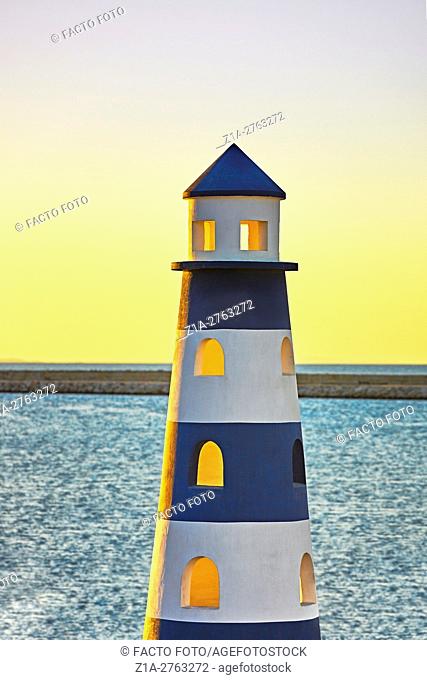 Lighthouse monument at the harbor. Denia. Alicante. Valencia Community. Spain