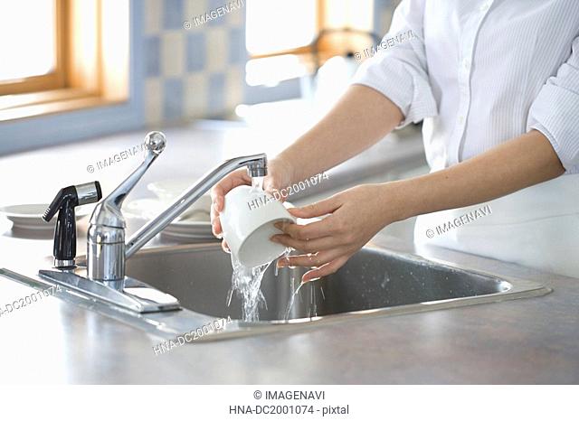 Woman Washing Cup
