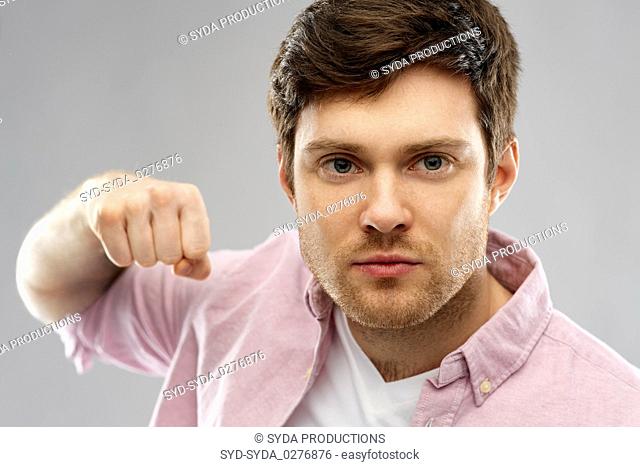 angry young man ready for fist punch
