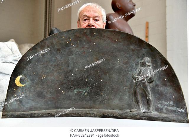 Sculptor Waldemar Otto stands behind a mould for a sculpture of poet Matthias Claudius in his studio in Worpswede, Germany, 14 January 2015