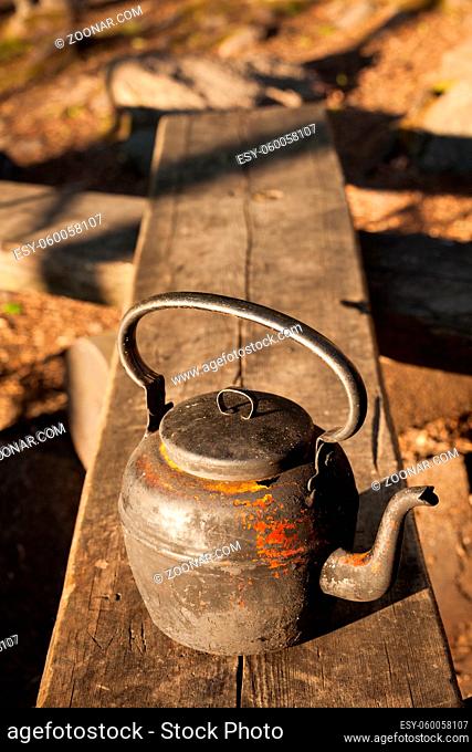 Old coffee pot in camping site used in open fire
