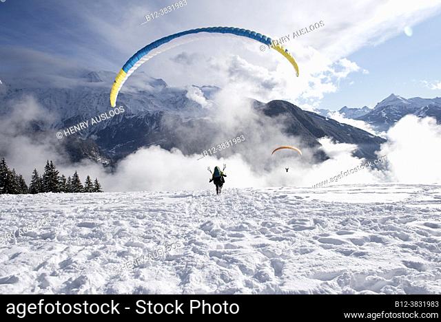 France, Haute Savoie (74), Alps, Passy, Plaine de Joulx, paraglider in winter; take -off