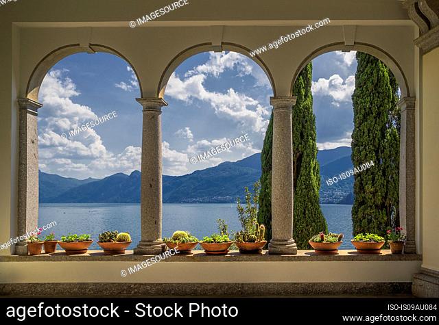 View from arched Arcades of Villa Monastero, Lake Como, Italy