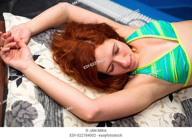 Attractive woman in bikini relaxing