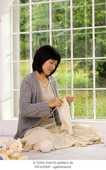 A Woman Knitting, Korea