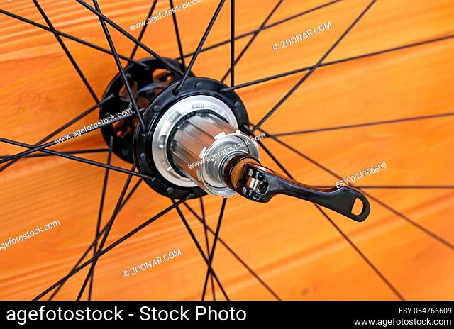 bike rear wheel against brown background