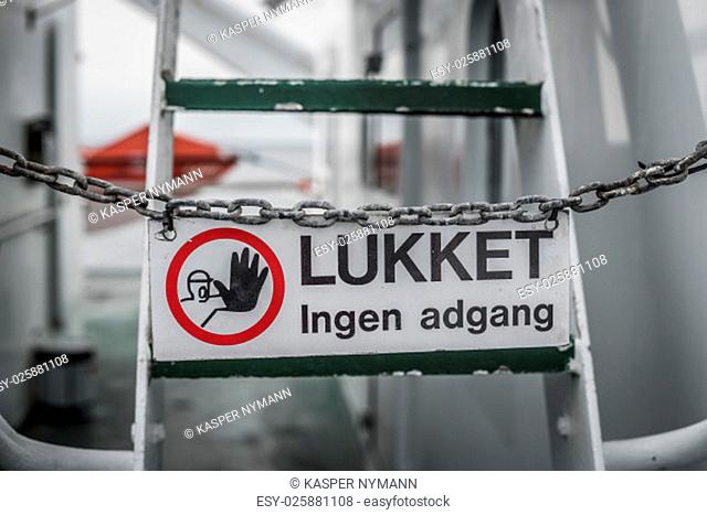 No access sign on a metal chain by a ladder