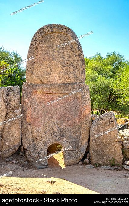 Arzachena, Sardinia / Italy - 2019/07/19: Archeological ruins of Nuragic necropolis Giants Tomb of Coddu Vecchiu - Tomba di Giganti Coddu Vecchiu - with front...