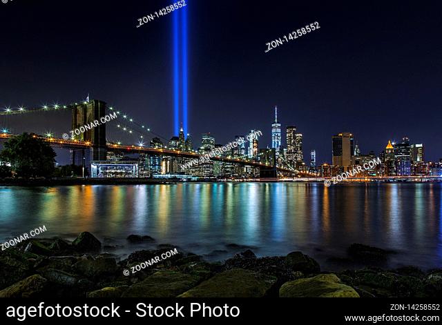 9/11 Tribute in Lights at Brooklyn Bridge and Lower Manhattan Skyline, New York United States