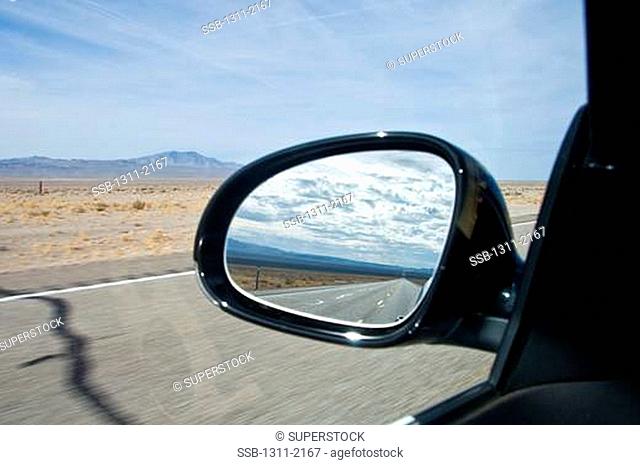 Reflection of a road in the side-view mirror of a car, Route 66, New Mexico, USA