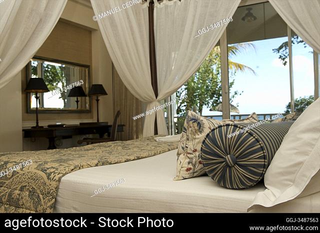 Mauritius Island. King size bed in a room with views at Le Telfair Hotel