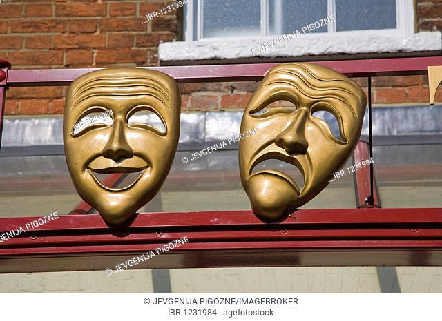 Masks of Comedy and Tragedy muses on the facade of Kenton Theatre on New Street, Henley-on-Thames, Oxfordshire, England, United Kingdom, Europe