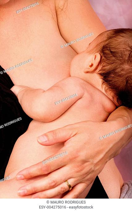 newborn baby and mom breast feeding