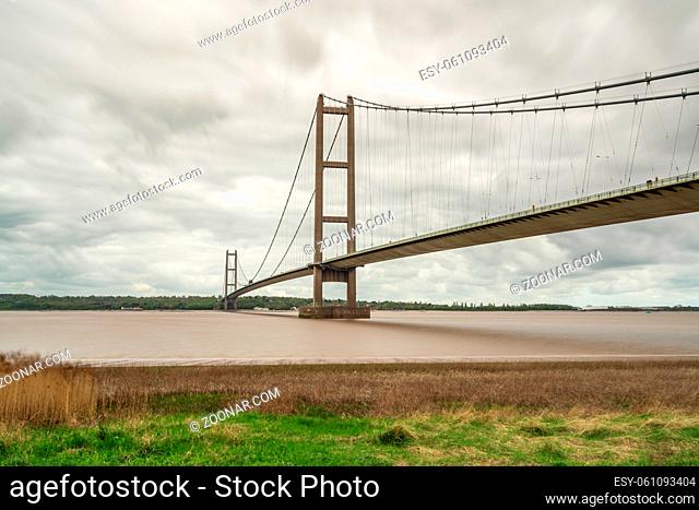 Grey clouds over the Humber Bridge, seen from Barton-Upon-Humber in North Lincolnshire, England, UK
