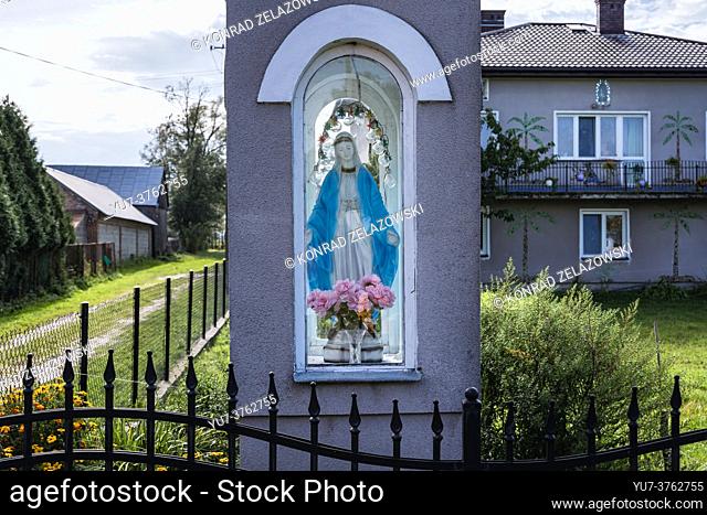 Shrine in front of house in small village in Masovian Voivodeship of Poland