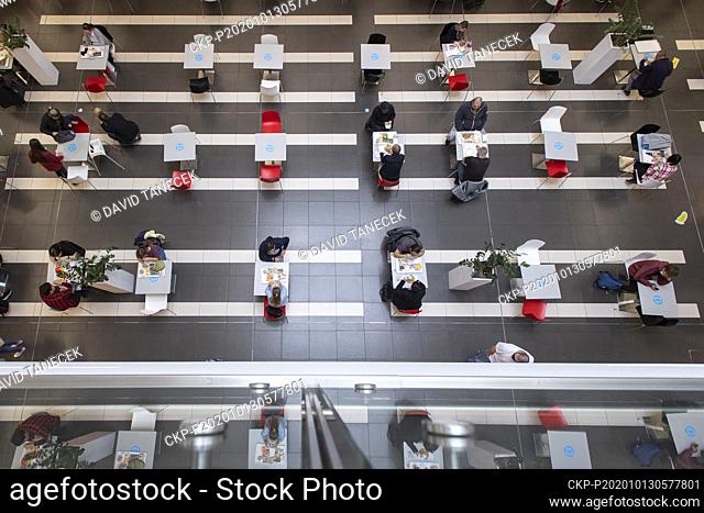 People have lunch in a fast food in the Futurum shopping center in Hradec Kralove, Czech Republic, October 13, 2020. The center has reduced the capacity of the...