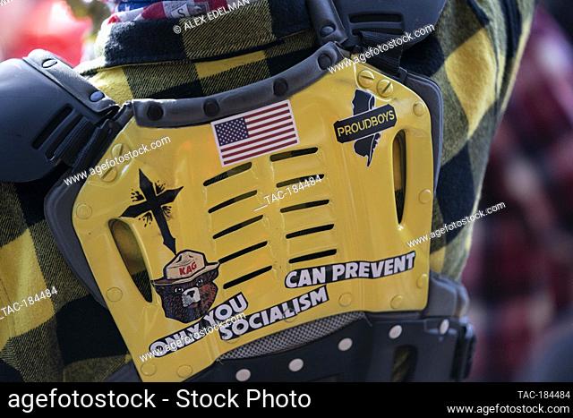 A demonstrator wears body armor with Proud Boys stickers while gathering during the ""Million MAGA March"" at Freedom Plaza in Washington, D.C., U.S