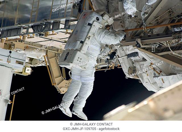 Astronaut Steve Bowen, STS-126 mission specialist, participates in the mission's first session of extravehicular activity (EVA) as construction and maintenance...