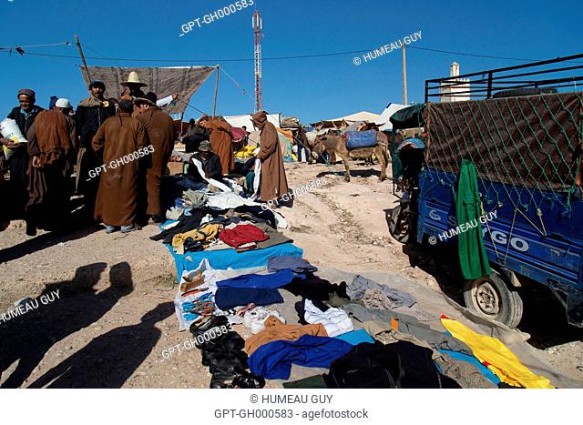 THE BERBER MARKET OF IDA OUDGOURD, A A STALL WITH SECONDHAND CLOTHING AND SHOES, A SOLELY MEN'S MARKET, ESSAOUIRA, MOGADOR, ATLANTIC OCEAN, MOROCCO, AFRICA