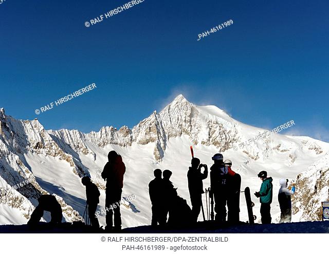 Tourists look at the Aletsch Glacier from the 2, 900 meter high Eggishorn on a sunny day in Fiesch, Germany, 06 February 2014