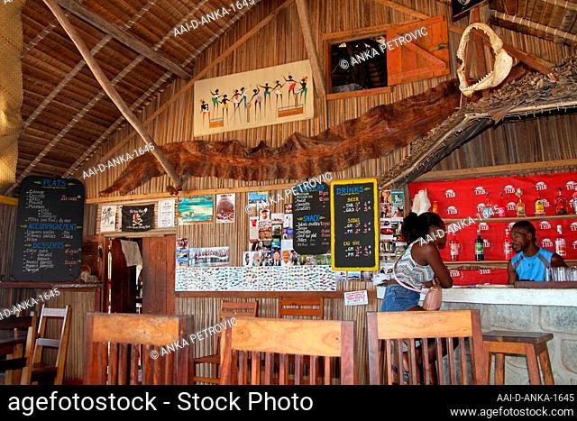 Interior of local pub with people at the bar, Ampangorinana Village, Nosy Komba Island, Madagascar