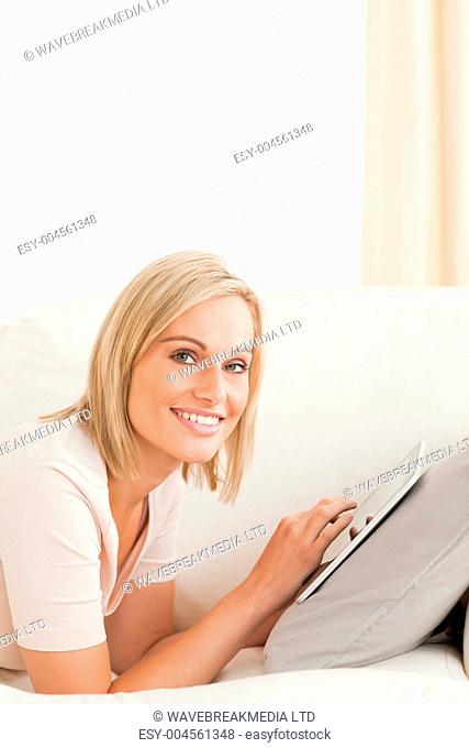 Portrait of a beautiful woman with a tablet computer