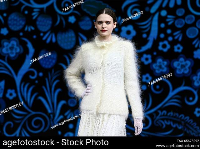 RUSSIA, MOSCOW - DECEMBER 12, 2023: A woman models Uryupinsk knitwear items during the Goat Down Fashion Show as part of the Russia Expo international exhibitio...