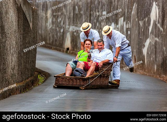FUNCHAL, MADEIRA - SEPTEMBER 19: Traditional downhill sledge trip on September 19, 2016 in Madeira, Portugal