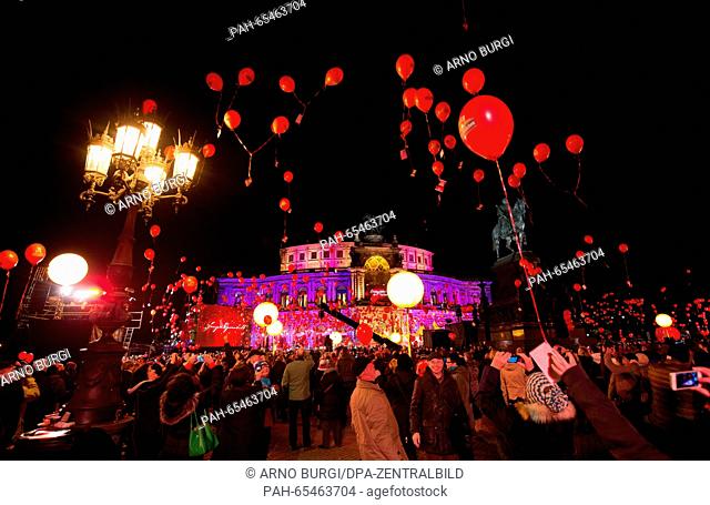 Visitors of the SemperOpernball 2016 release ballons in front of the Semperoper opera house at the Theaterplatz square in Dresden, Germany, 29 January 2016