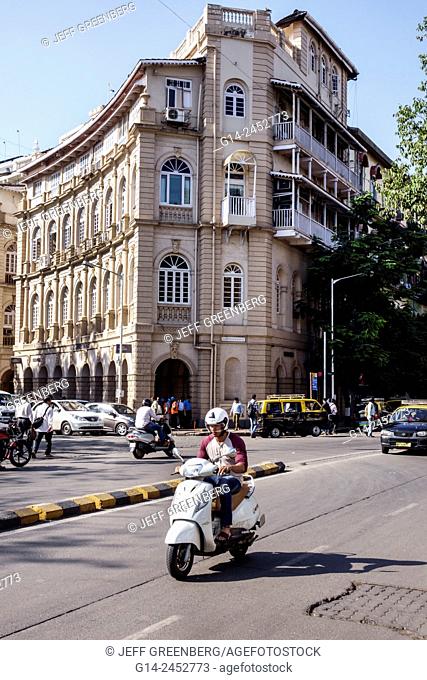 India, Indian, Asian, Mumbai, Fort Mumbai, Kala Ghoda, Horniman Circle, Shahid Bhagat Singh Road, Hanuman Building, man, motor scooter, helmet