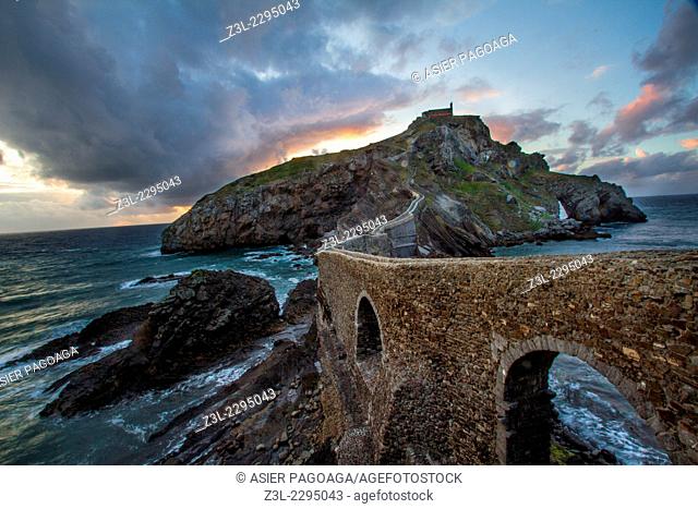 Gateway junction with the chapel of St. John of Gaztelugatxe at sunset, coast of Bizkaia in the Cantabrian Sea, Bizkaia, Basque Country, Spain