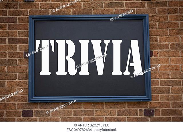 Conceptual hand writing text caption inspiration showing Trivia. Business concept for Unimportant Quiz Fun written on announcement road sign with background and...